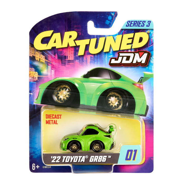 Green Toyota car in 'Cartuned' packaging with colorful background