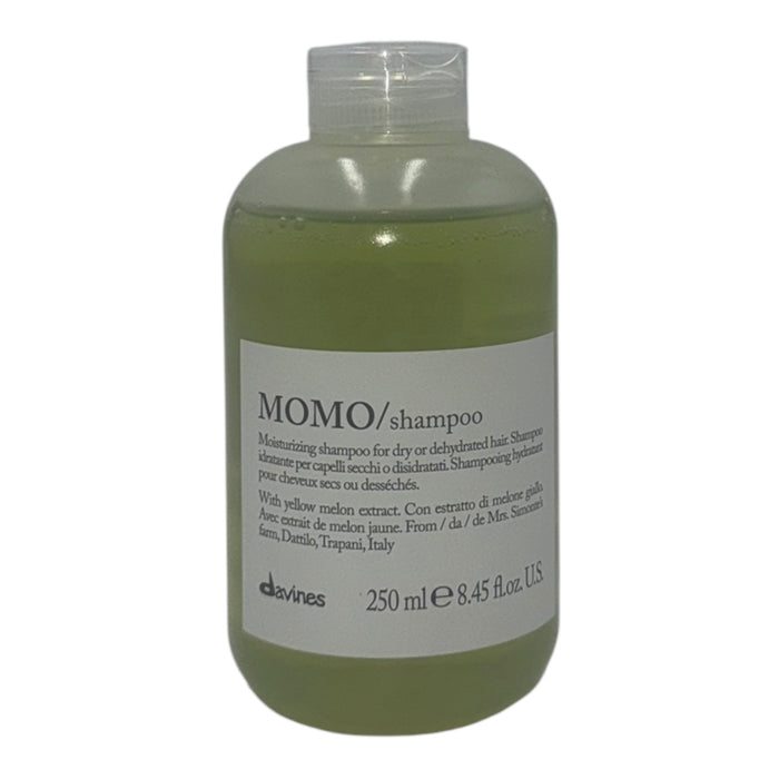 Bottle of Davines Momo shampoo on a white background
