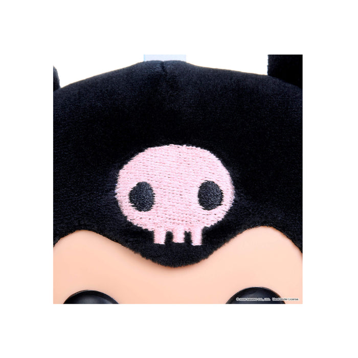 Close-up of a plush toy with a black head and pink skull design on a white background