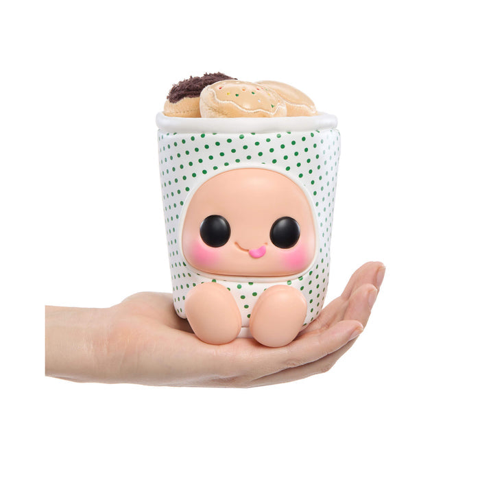 Small container with a face design held in a hand, filled with bread.