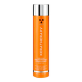 A tall orange bottle of KeraTherapy Color Protect Conditioner with a reflective silver cap, centered on a plain white background.