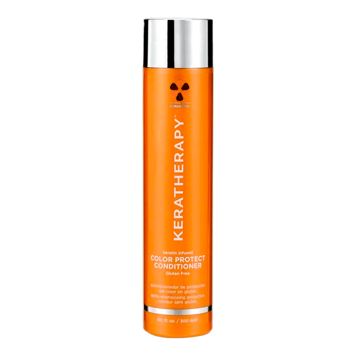A tall orange bottle of KeraTherapy Color Protect Conditioner with a reflective silver cap, centered on a plain white background.