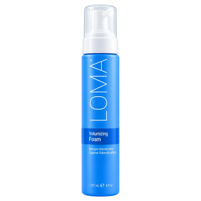 A blue pump bottle of LOMA Volumizing Foam with a clear cap, shown on a plain white background.