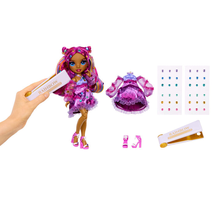 Colorful doll with accessories and a hand holding the gem tool on a white background