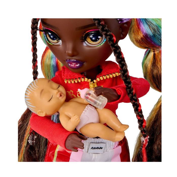 Close up of doll holding baby on a white background