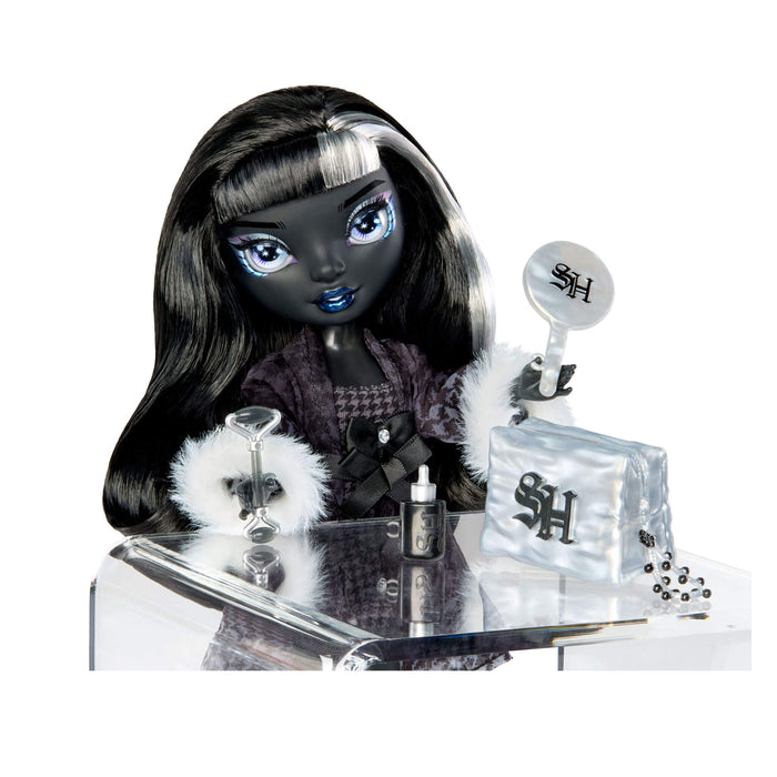 Doll with branded Shadow High accessories on a reflective surface