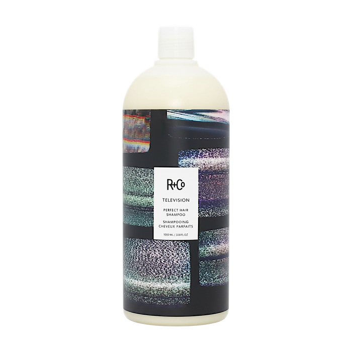 A 1L bottle of RCO Television Perfect Hair Shampoo with a white cap and a black label featuring a colorful, textured pattern, set against a plain white background.