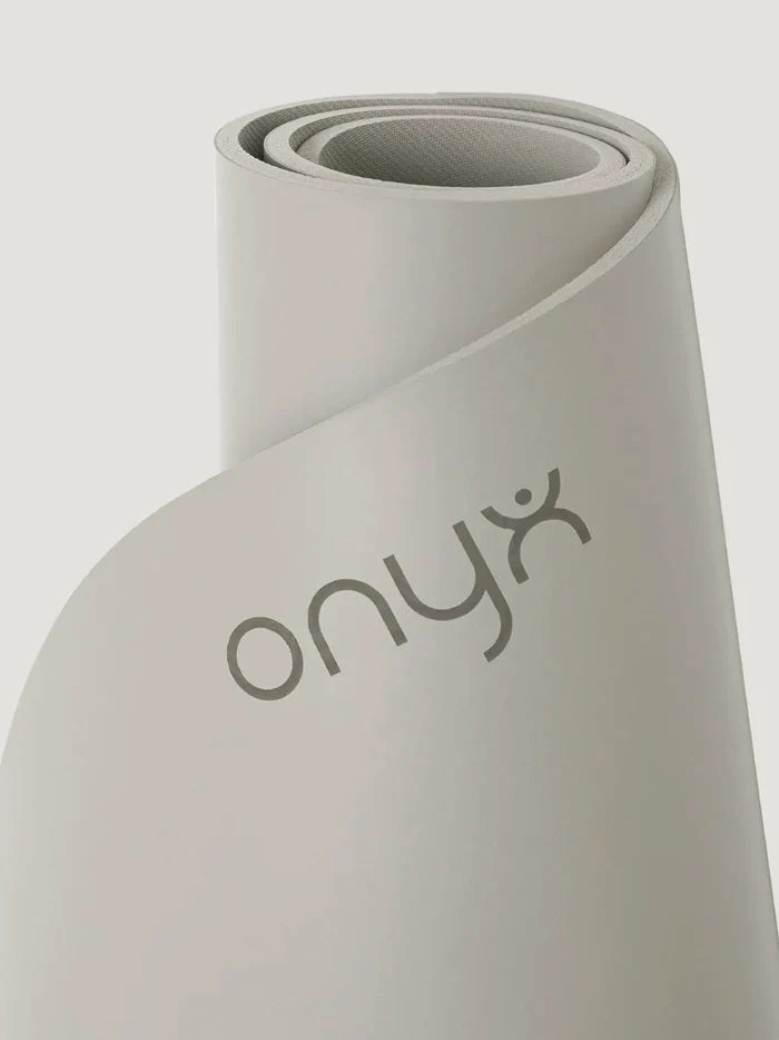 Grey yoga mat with 'Onyx' branding